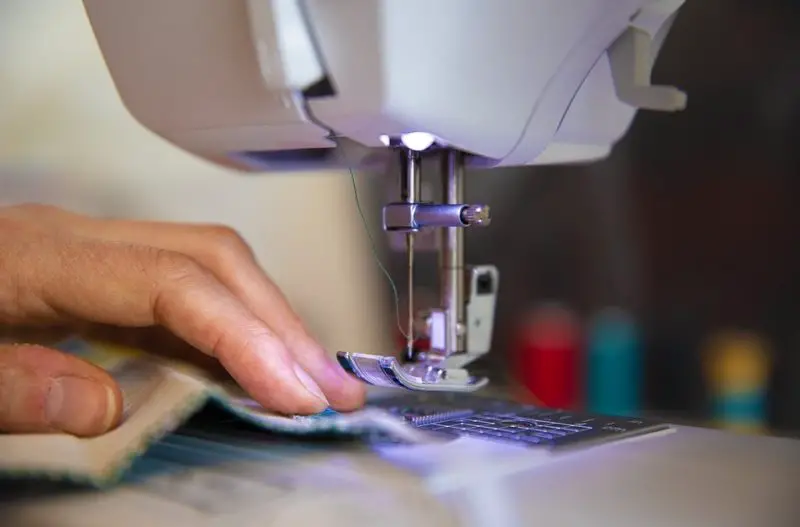 how to adjust needle position on sewing machine
